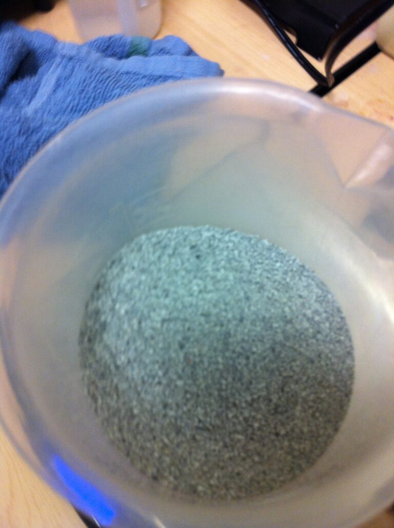 Bentonite Clay: grey-green bentonite clay powder in a bowl