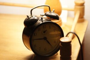 A classic twin-bell alarm clock on a table