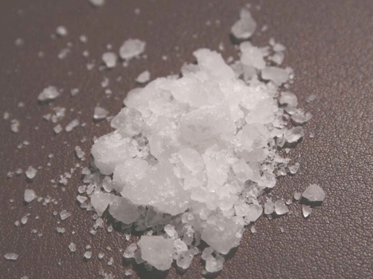 A small pile of white edible salt crystals