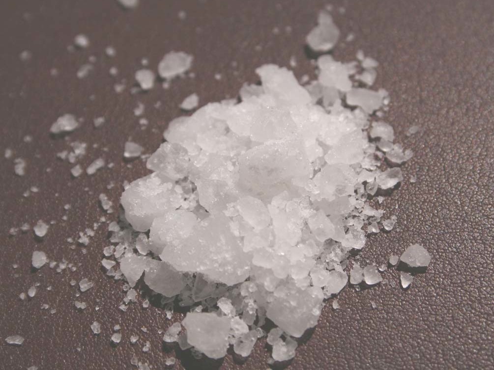 A small pile of white edible salt crystals