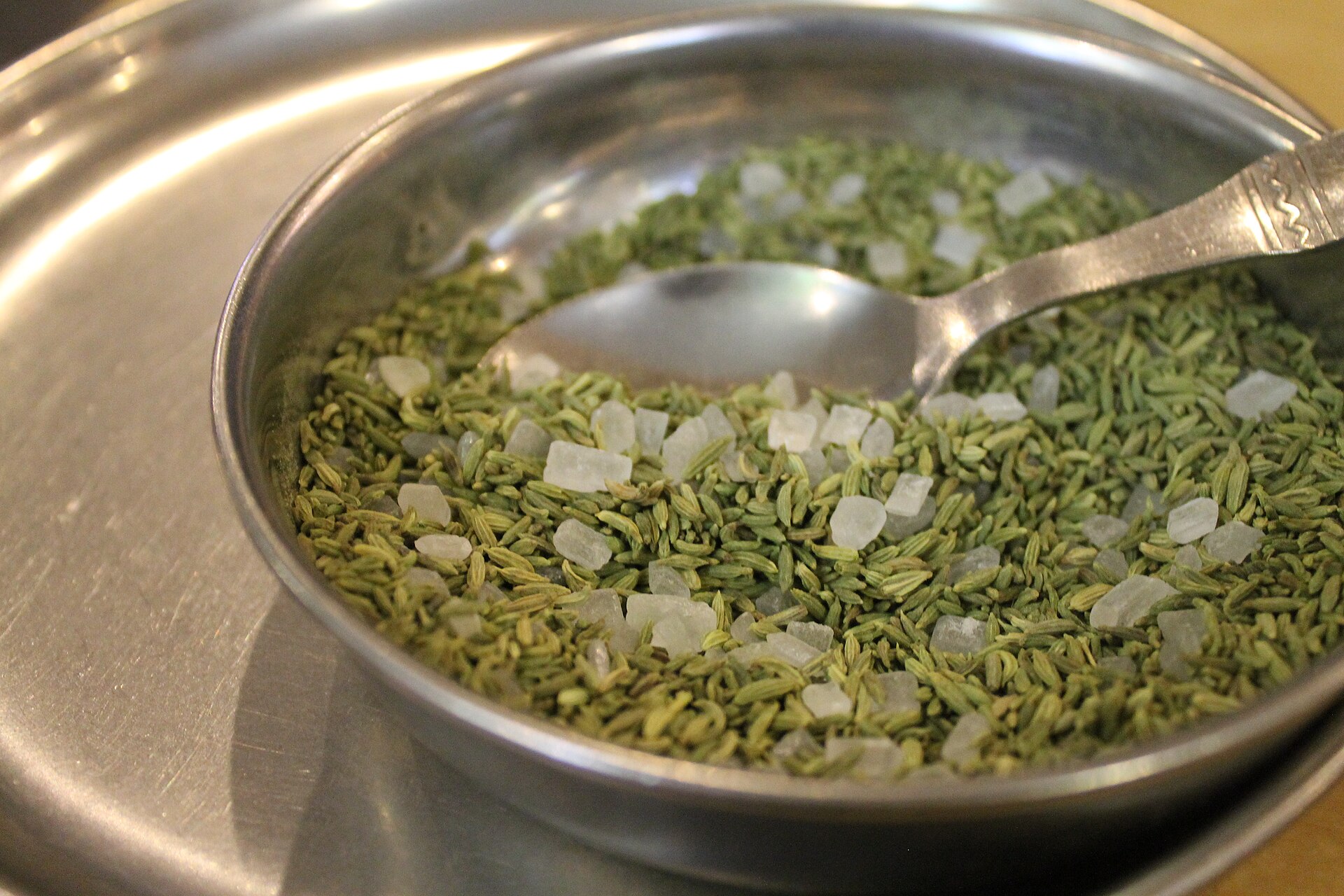 A bowl of fennel seeds with sugar crystals, the after-meal digestive served in India