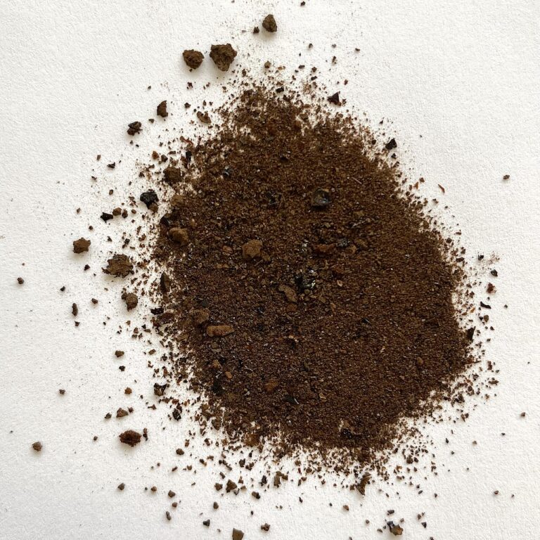 A small heap of brown fulvic acid powder isolated from peat