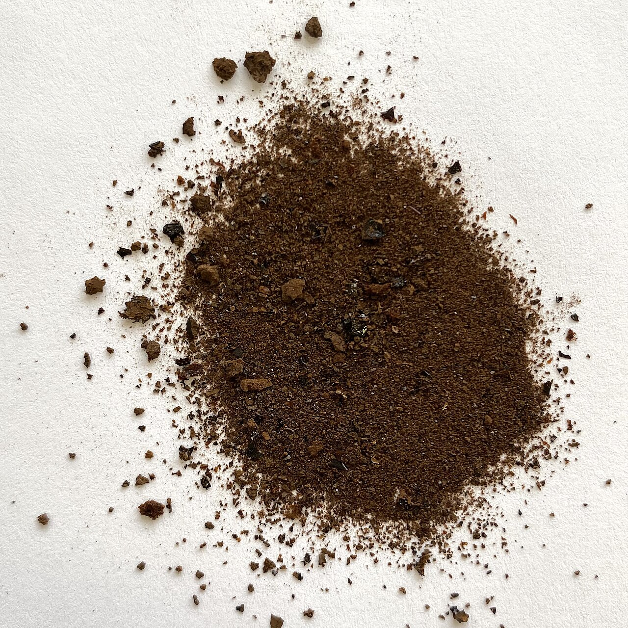 A small heap of brown fulvic acid powder isolated from peat