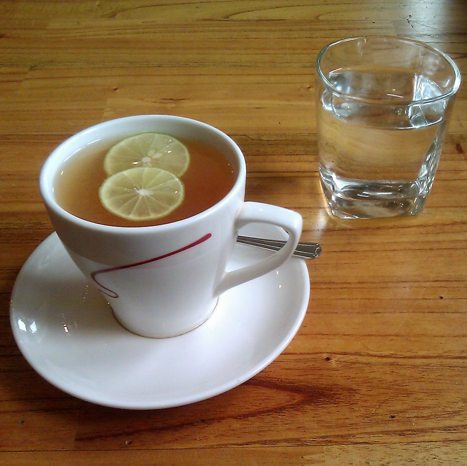 A glass of water with lemon