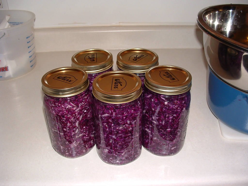 Glass jars filled with homemade red cabbage sauerkraut